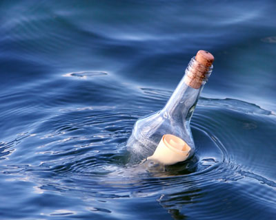 message in a bottle floating on water